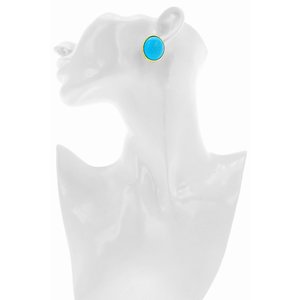 BARBARA - An oval shaped earring with thin metal border, a charge of light on your face!
Jewel made of light gold and turquoise resin. - A.Z. Bigiotterie