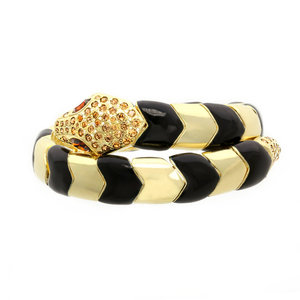 PYTHON - PYTHON &egrave; un bracciale a forma di serpente che avvolge il polso in maniera elegante, ed &egrave; realizzato in oro chiaro con strass light colorato topaz e occhi topazio scuro e smalto nero. - A.Z. Bigiotterie