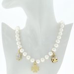 Oro rodio chiaro con strass cristallo, cabuchon e strass neri (coccinella) con perle bianche